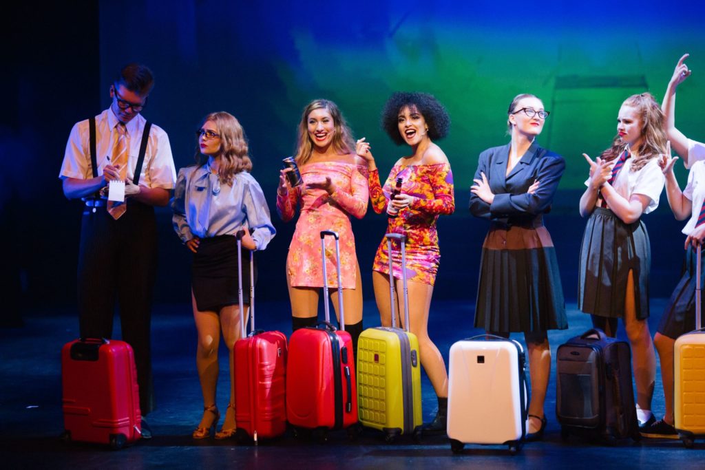 Performers College Stage production colourful suitcases