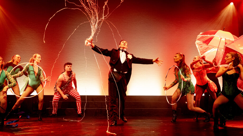 cat of magic perform a dance in the style of a magician's performance